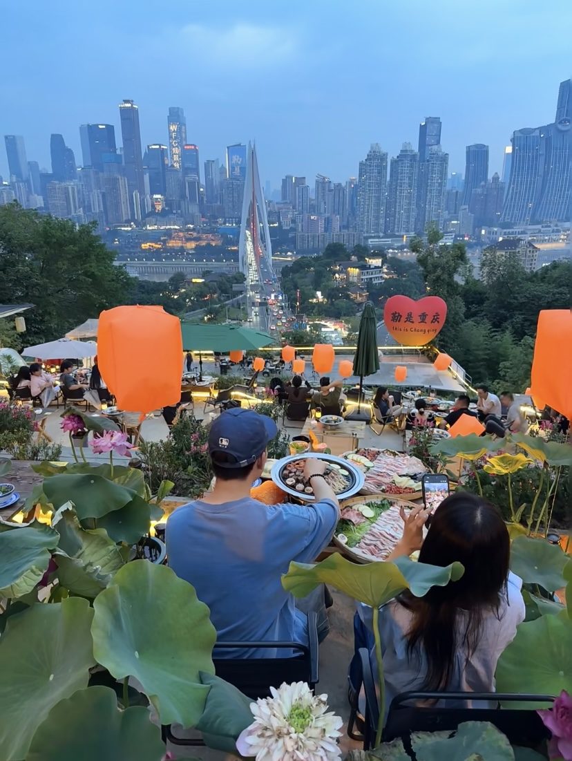 Rooftop hotpot with a Chongqing skyline view